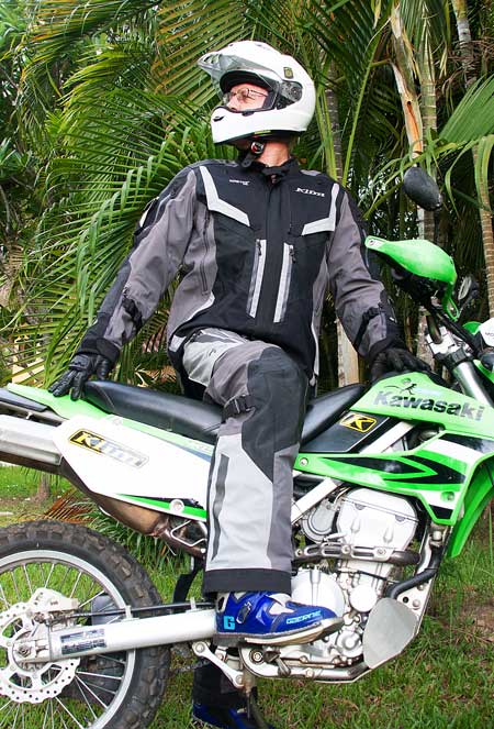 A photograph showing a full ATGATT adventure motorcycle gear kit combining  the best armored touring pants and jacket from Alpinestars as Class-AA  protective equipment for riders - Motorcycle Gear Hub